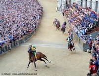 The Palio race at the Casato Bend