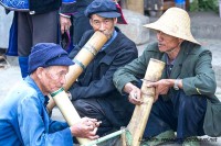 men smoking using bamboo tubes Panzhihu 