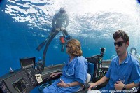 Submersible being helped descend cocos island